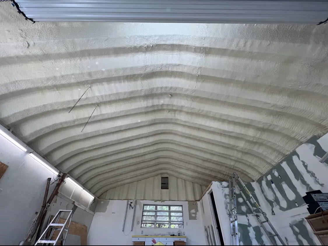Spray polyurethane foam applied to the underside of a metal roof deck in Penn